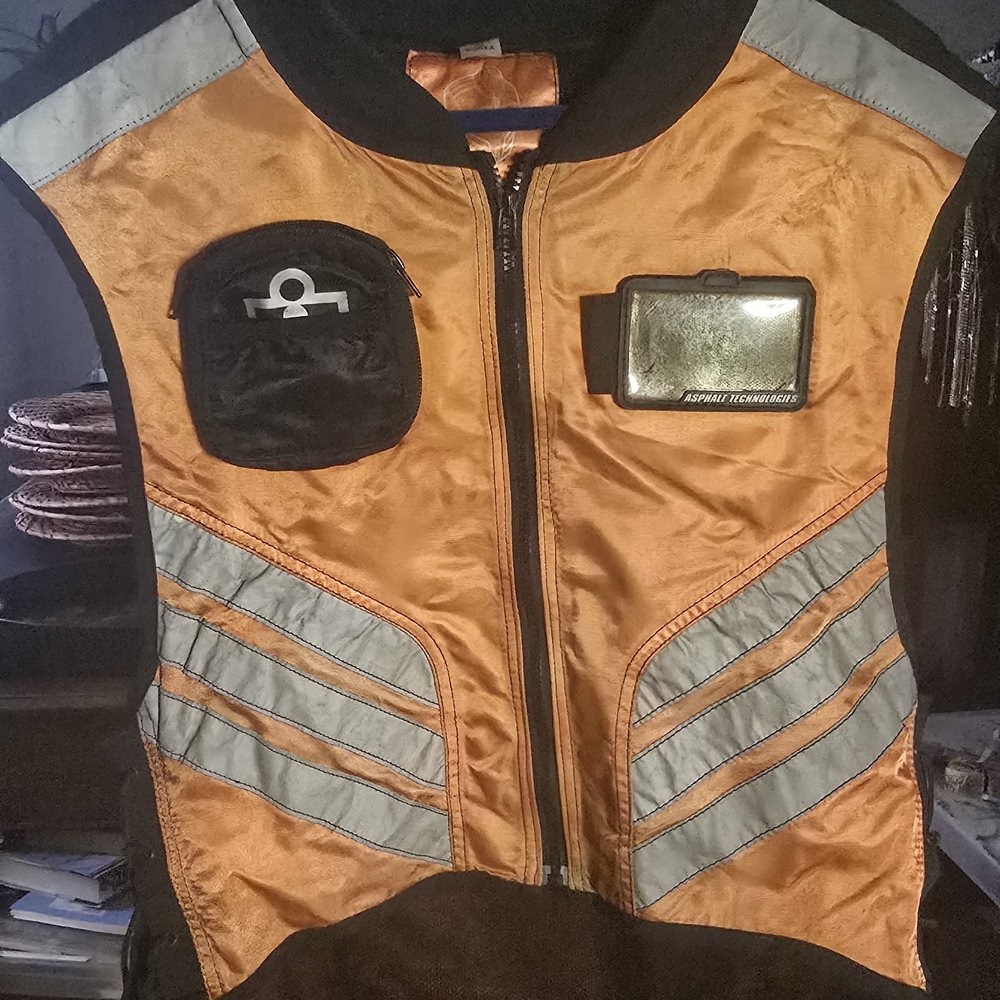 ICON Orange and Black Motorcycle Vest with Silver Accents